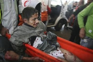 1493280789-palestinians-carry-a-wounded-youth-who-according-to-palestinian-medical.jpg