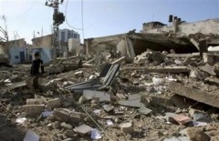 509241330-a-palestinian-boy-walks-on-the-rubble-of-a-building.jpg